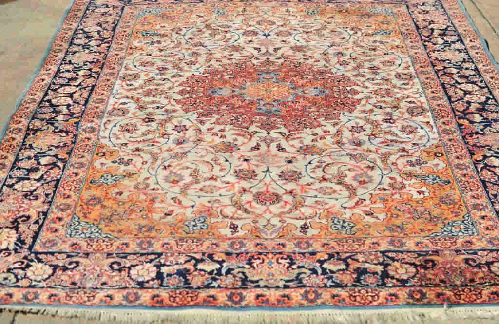 Persian Seirafian Esfahan Silk Rug: Cream color base with bright orange, pink, and blue arabesque designs. Navy color border. 120 Inches by 76 Inches
