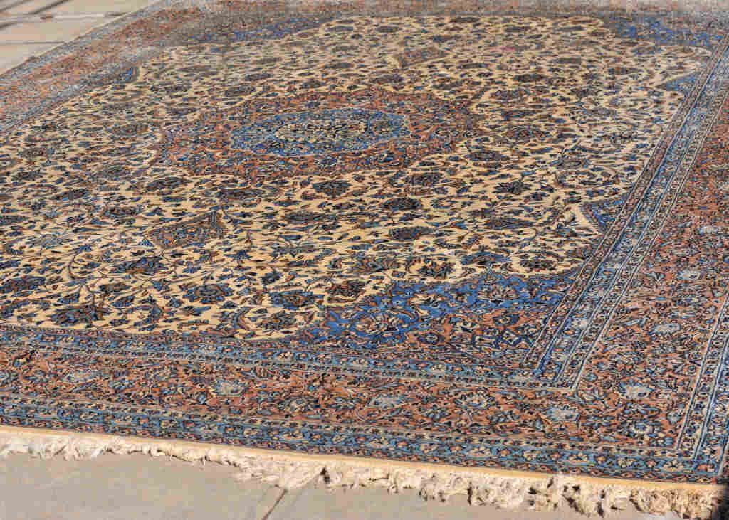 Large Oriental Wool Carpet: Intricate blue, brown, and beige floral pattern. Length 142 Inches Width 202 Inches
