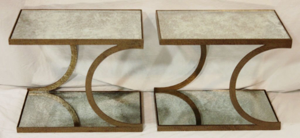 Pair Mid Century 2 Tier Smoke Mirrored End Tables: Two-tier with mirrored shelves. One with a small chip. Height 16.25 Inches Width 20 Inches Depth 12 Inches