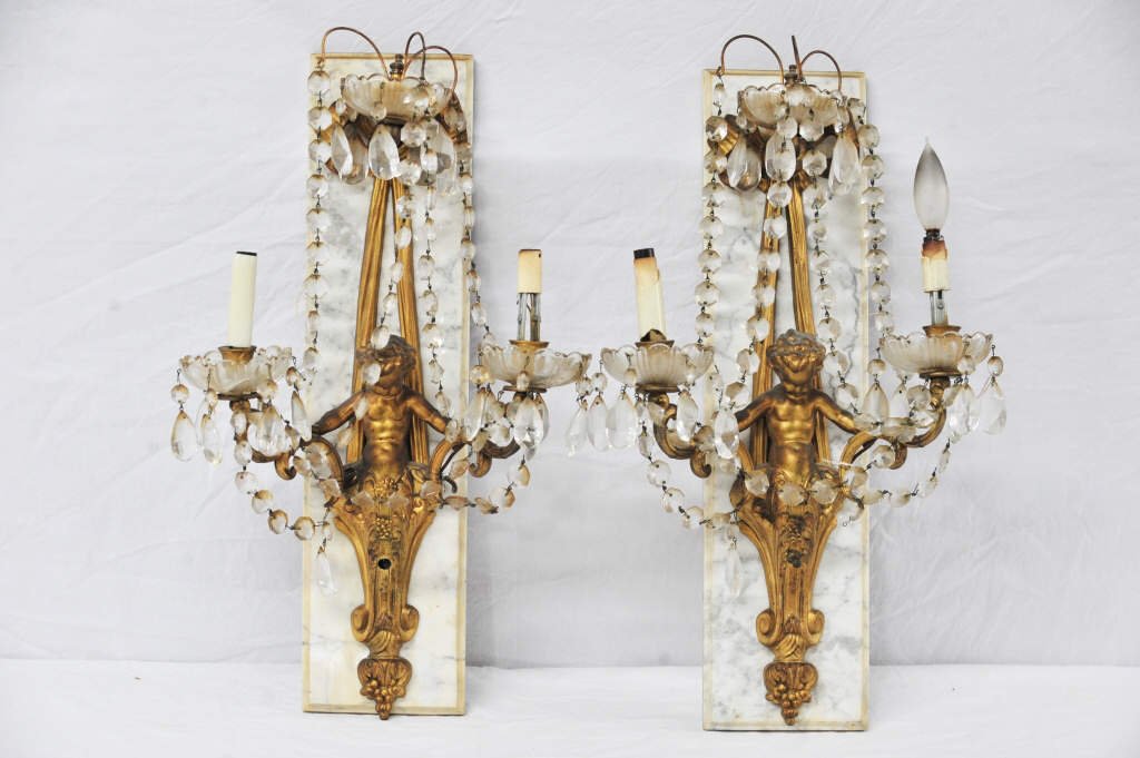 Pair of Marble Mounted Bronze Putti Wall Sconces: With hanging crystals Height 24 Inches Width 6.5 Inches Depth 1 Inch