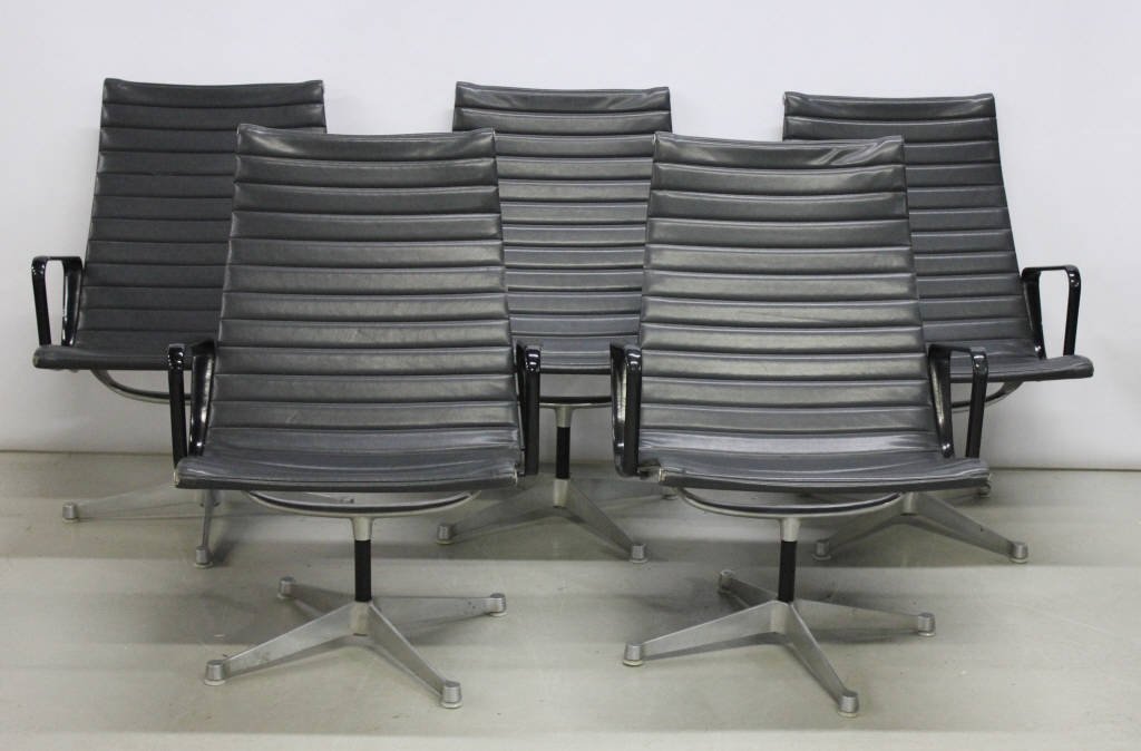 Five Herman Miller Swivel Arm Chairs: Aluminum Frames , Black Arms , Stamped Henry Miller Height 35 Inches Width 25 Inches Depth 15.5 Inches