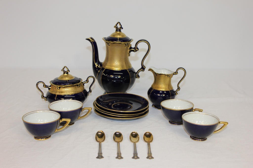 Porcelain Demi Tasse set Germany JLMENAU ILMENAU: Teapot,Creamer,Sugar,four teacups, four Saucers Signed on Bottom. Four Demitasse spoons Perfect condition Height teapot 8 Inches Creamer 3.5 Inches,