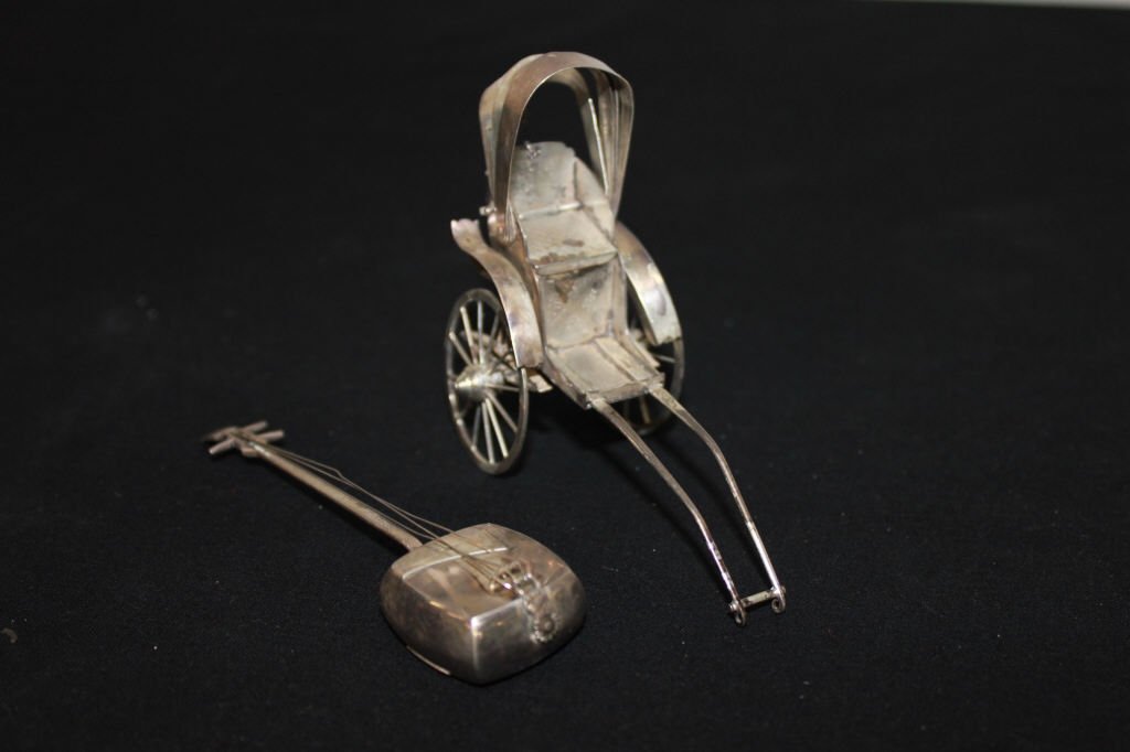 One Sterling silver Shamisen &rickshaw Salt/Pepper: Sahmisen Marked Sterling length 4 Inches 14.2 grams Rickshaw does not test for silver