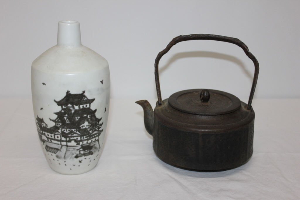 Cast Iron Tea Pot and Sake Bottle Japanese: Teapot Height 8 inches Width 6.5 inches Sake bottle height 9 inches width 4 inches