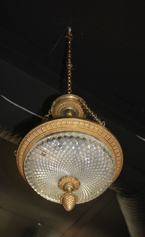Early 20thc Bronze and Cut Crystal Chandelier: Pineapple finial Three Lite Height 16 inches Diameter 11 inches