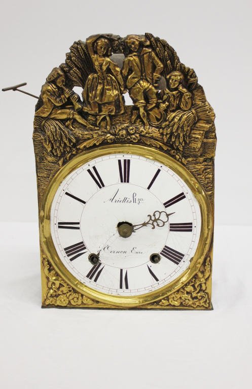 Antique Clock made in Vernon Eure: Height 16 inches Width 10 Inches Depth 5.5 Inches Pressed Tin Figures, Cracked enamel Face, One Hand missing