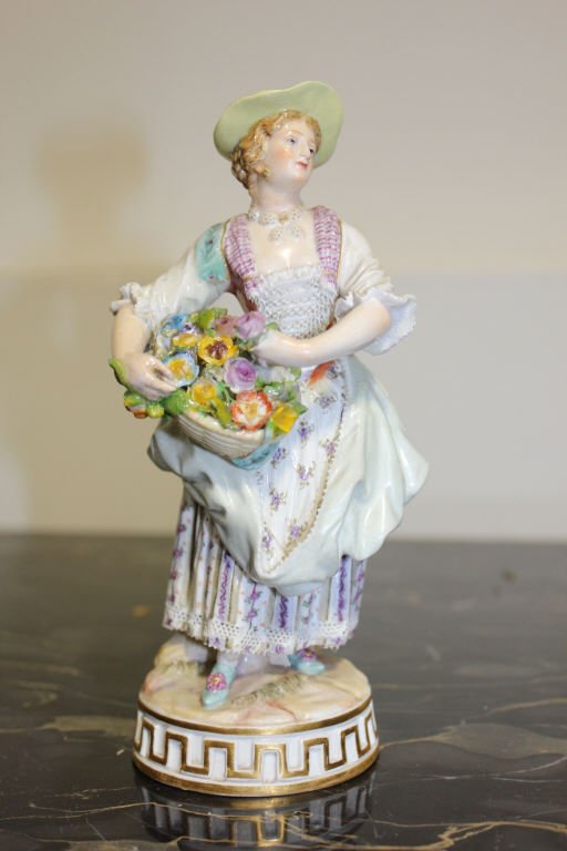 Meissen Flower Girl: Girl Holding basket of flowers Height 6.5 Inches Stamped on bottom