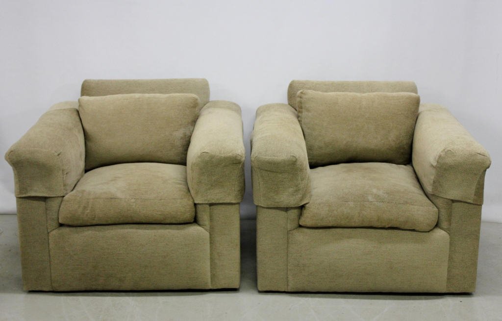 Pair of Contemporary Velour Swiveling Club Chairs: On wheels. Height: 30 inches. Width: 36 inches. Depth: 36 inches.