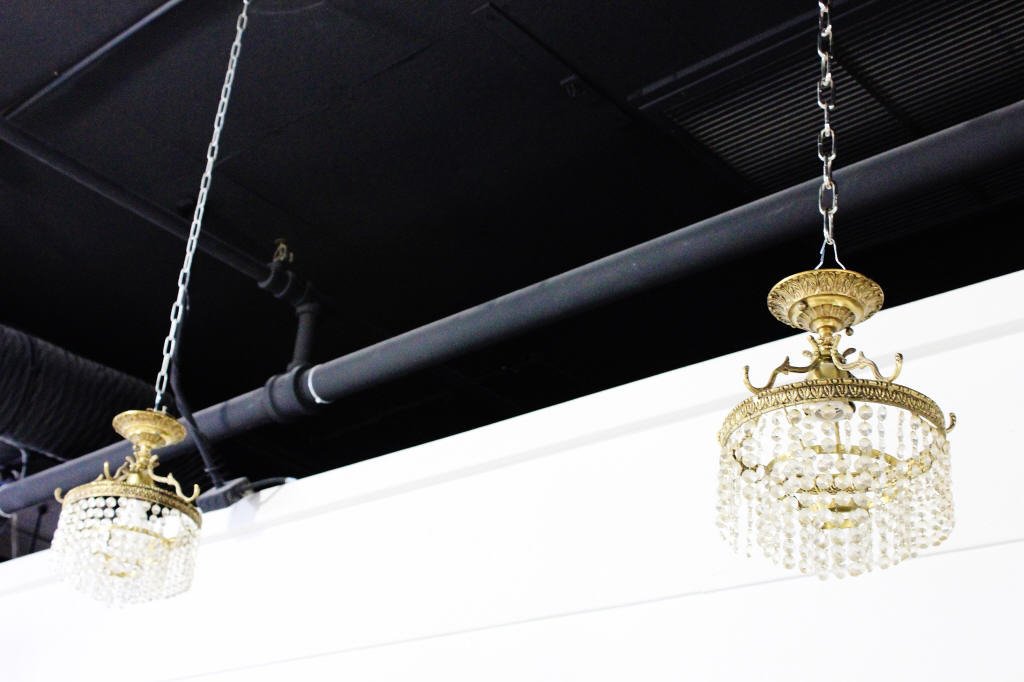 Pair of Bronze and Crystal Light Fixtures: Height: 11 inches. Width: 8.5 inches.