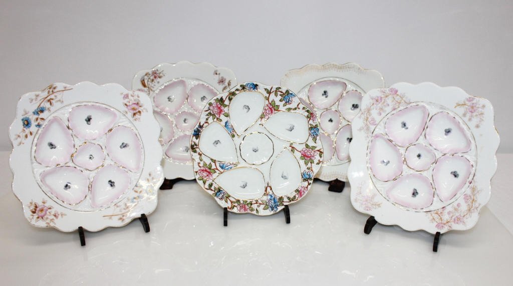 5 Mark & Gutherz, Carlsbad Porcelain Oyster Plates: One 5-depression geometric oyster plate in pink, brown and grey floral . One 5-depression geometric oyster plate in pink, brown, grey and blue floral. One 5-depression geometric oyster plate in pink, 