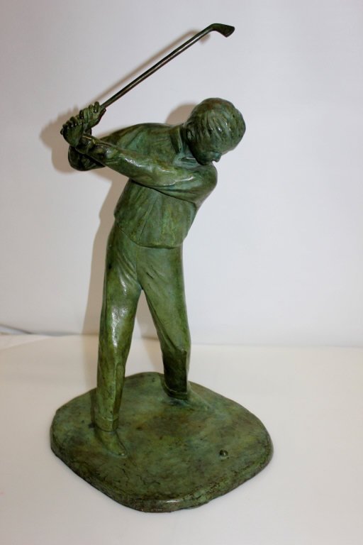 Patina Bronze Golfer Sculpture: Signature illegible. Height: 21 inches. Width: 12 inches,