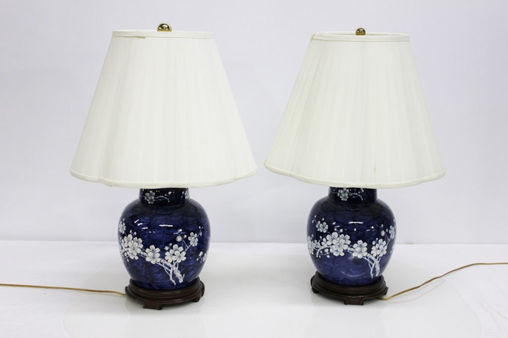Two Chinese Blue and White Lamps: Height: 24 inches.