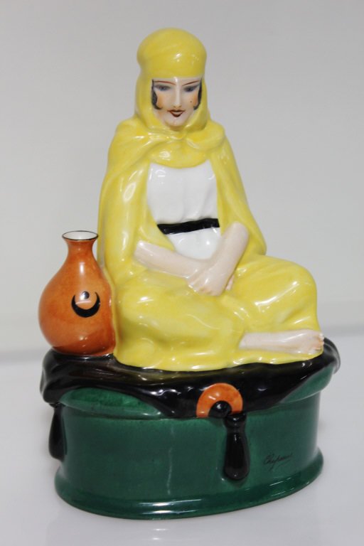 Chiparus Porcelain Arabian Woman Figural Jar: Signed. Marked Editions Ething Paris. Height: 9.5 inches. Length: 5.5 inches. Width: 3.5 inches.