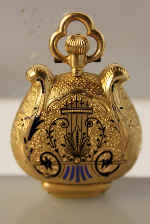 Lyre Form Pocket Watch Marchand and Sandoz: with blue paint cracked crystal Rose gold 18K Marchand and Sandoz Suisse Portrait inside Approx 21 DWT inclusive PLEASE SEE OUR SHIPPING TERMS AND CONDITIONS AND POLICES REGARDING THIS AUCTION