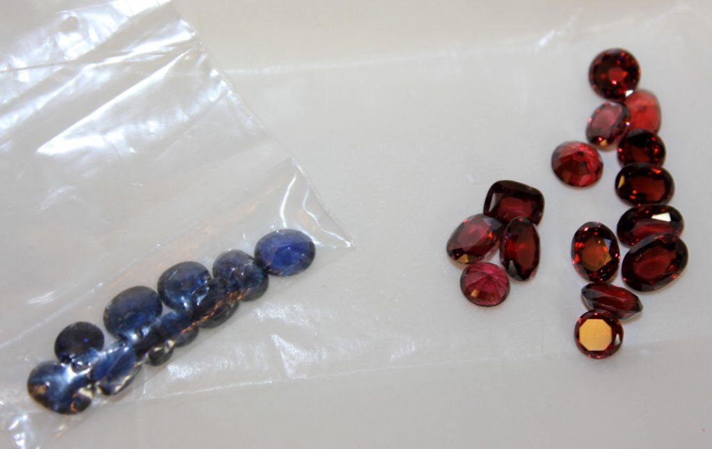 Lot of Stones: 15 Red Stones, 10 synthetic sapphires PLEASE SEE OUR TERMS AND CONDITIONS AND POLICIES CONCERNING THIS AUCTION