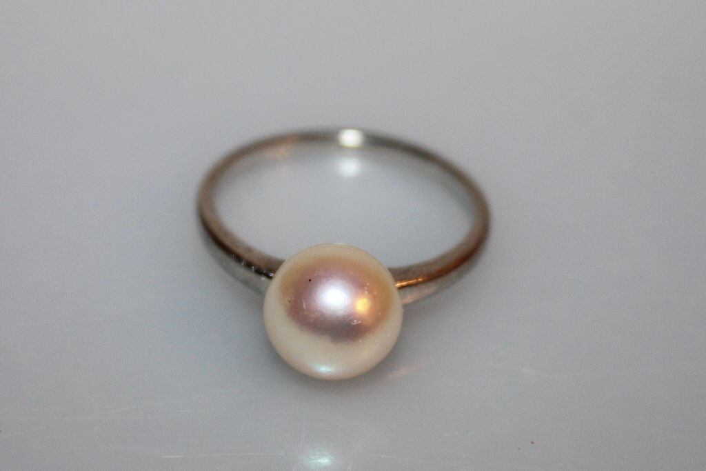 One Platinum Ring with Single Pearl Setting: approx 2.70 dwt inclusive .148