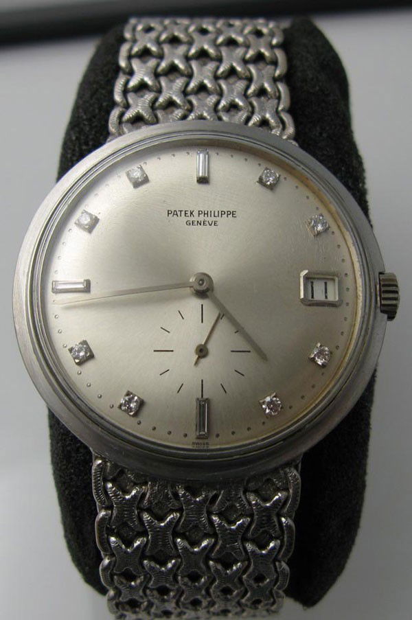 Watch: Patek Philippe Calatrava, diamond. Working: Watch: Patek Philippe Calatrava pre-own with custom set diamond (PP 3445) working order.