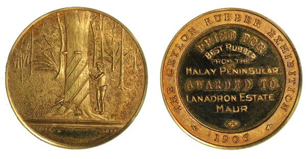 MALAYA. Gold Medal by Sinkers & Medallists present: MALAYA. Gold Medal by Sinkers & Medallists presented by "THE CEYLON RUBBER EXHIBITION ) in 1906 to LANADRON Estate MUAR for "BEST RUBBER FROM THE MALAY PENINSULAR" Dia: Weight: UNC, original case, ver