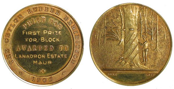MALAYA. Gold Medal by Sinkers & Medallists present: MALAYA. Gold Medal by Sinkers & Medallists presented by "THE CEYLON RUBBER EXHIBITION ) in 1906 to LANADRON Estate MUAR for "First prize For Block" Dia: Weight: UNC, original case, very rare.