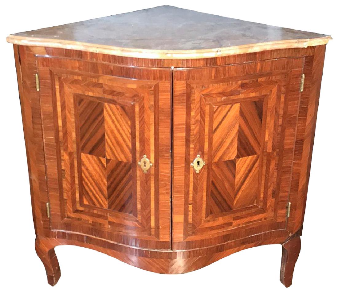 An Early French Mahogany And Rosewood Corner: cabinet, with a faux marble top, circa early 19th century, damage to right hand corner, 34 inches wide 23 inches deep by 32 inches high