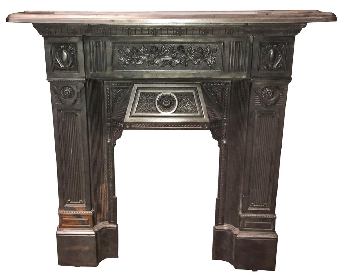 A Victorian Polished Steel Mantle, Fireplace: surround, circa 1880, with very nice detailing and small size, 43 inches wide by 43 inches high x 7 inches deep, opening is 17 inches wide 24 inches high.