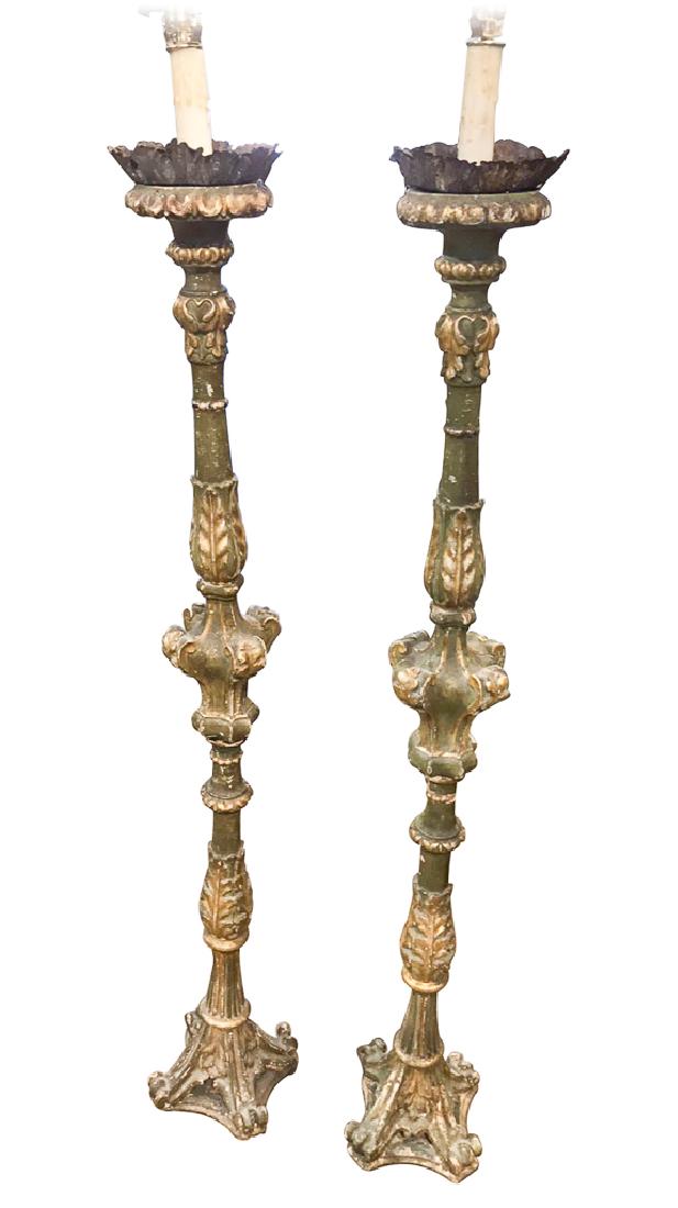 Rare Pair Of Period Italian Torchieres,: 18th century carved wood with old paint and gesso finish and original iron candleholders, have been electrified into floor lamps. 60 inches high to top of wax candle sleeve