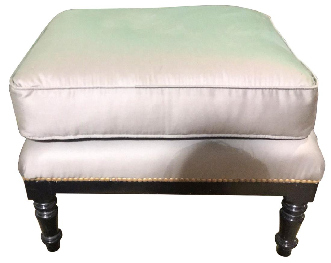 A Black Lacquered Turned Leg Footstool With: brass nail head trim, and good silk upholstery. 25 inches long by 19 inches wide by 18 inches high, good condition