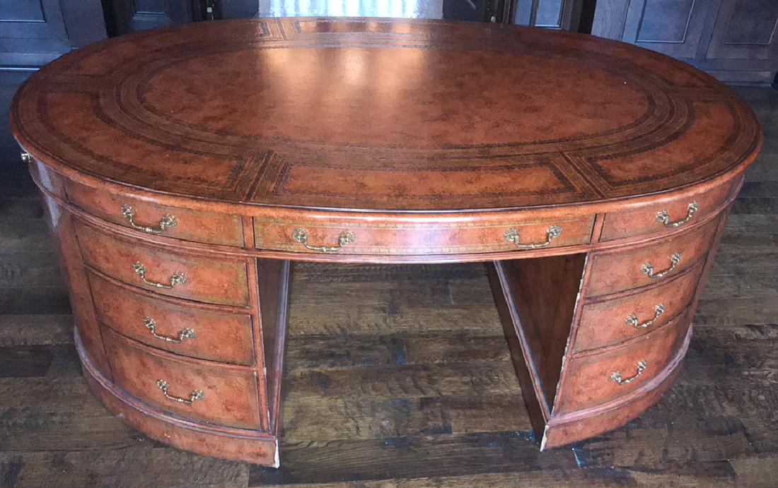 Maitland-Smith Leather Oval Partners Desk: Minor wear at bottom corners. Top and drawers in excellent condition. Beautiful floating desk for an office. Last minute sale addition from a fine Dallas estate. 70w x 40d x 29.5h