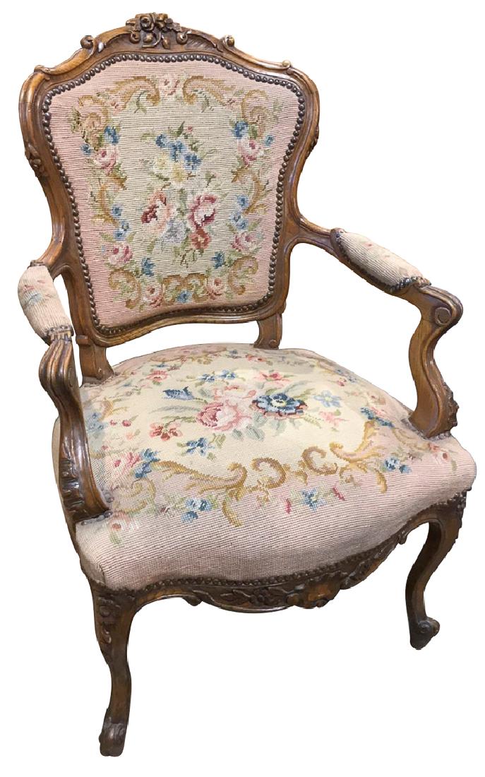 Beautiful French Walnut Fauteuil, With Antique: needlepoint upholstery and nicely carved,excellent condition, well scaled, good patina. 36 inches x 25 inches wide 22 inches deep, from the Gary Elam Estate.