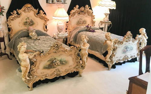 Magnificent Pair Of Italian Rococo Carved Beds: Adorned With Large Hand Carved Cherubs And Hand Painted Courting Scenes. Creme Lacquer Background With Gold Water Gilded Accents. Late 19th Or Early 20th C. Very Rare And Truly Fine Quality. From The