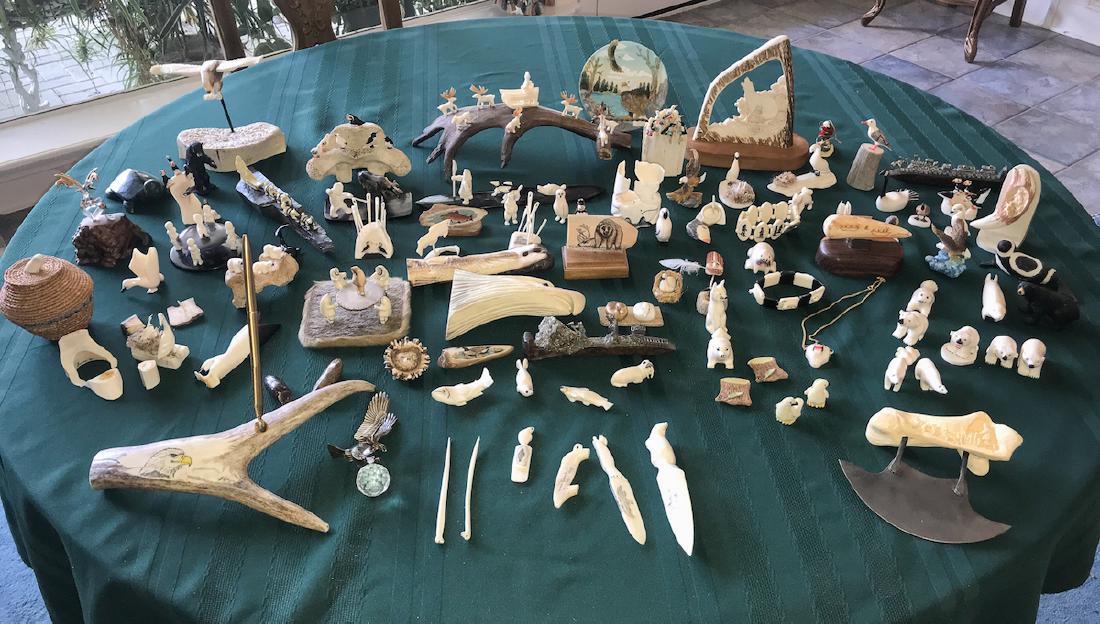 Fine Collection Of Alaskan Bone and Scrimshaw: Whale And Walrus Teeth. 90 Pieces. Includes Custom Lighted Corner Display Cabinet. 72h X 29w. Estate Of Ken And Pat Hodge.