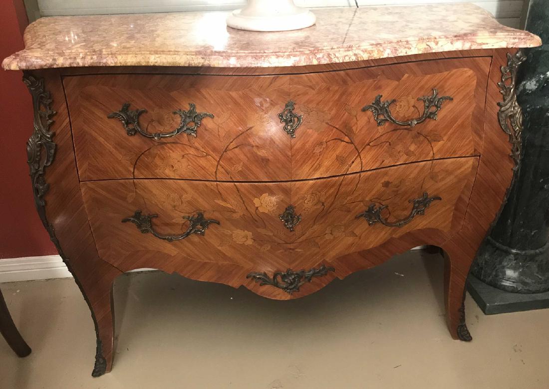 French Louis Xv Inlaid Commode.: Serpentine Fronted And Of Bombe Form With A Rouge And Butterscotch Tinted Marble Top. The Three Drawers With Inlays Depicting Meandering Vines With Flowers. Ornate Bronze Pulls And Appointments, Circa
