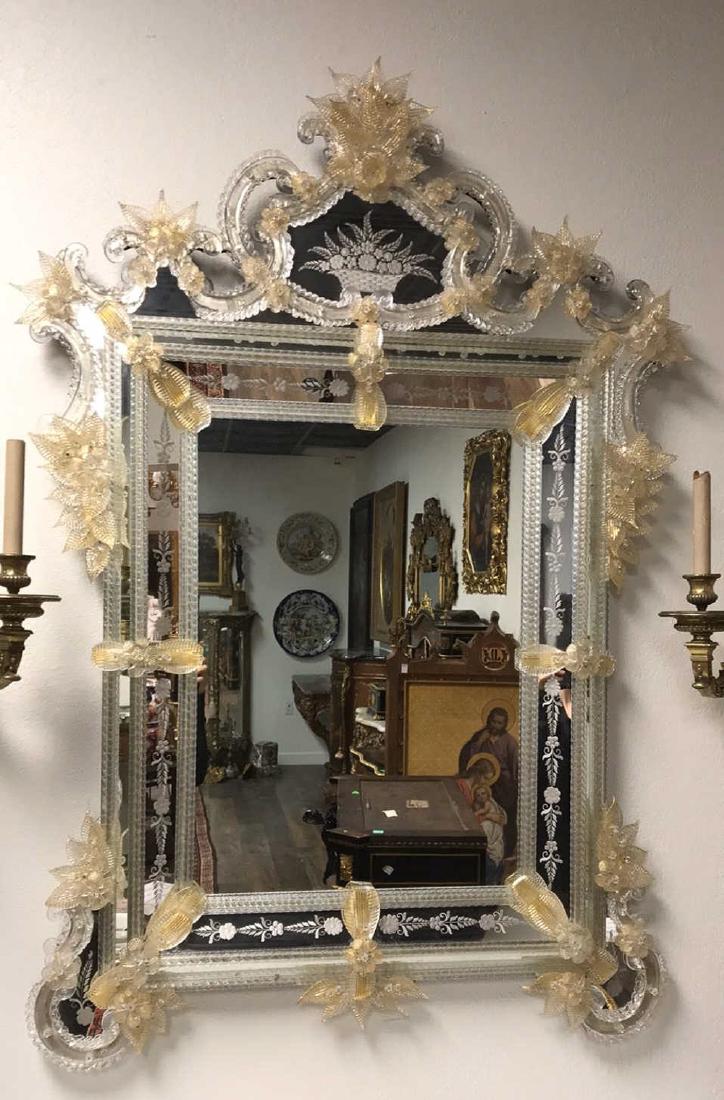 Antique Venetian Glass Mirror.: Having An Amber-tinted Leaf Spray Crest Above An Etched Cartouche Depicting A Basket Full Of Flowers. The Shaped Frame Accented With Large Flower-heads And Leaves. 54h X 36w. From The Sandra Clements