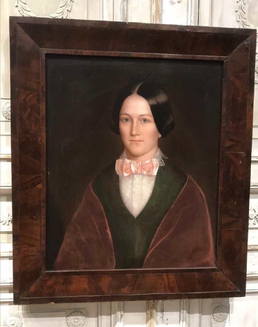 English Oil On Canvas Painting.: Finely rendered 19th century portrait depicting a young woman wearing white lace, a pink bow, and shawl. A peaceful pose with an air of elegance and grace. Artist unknown. Unsigned. 33W x 38H.