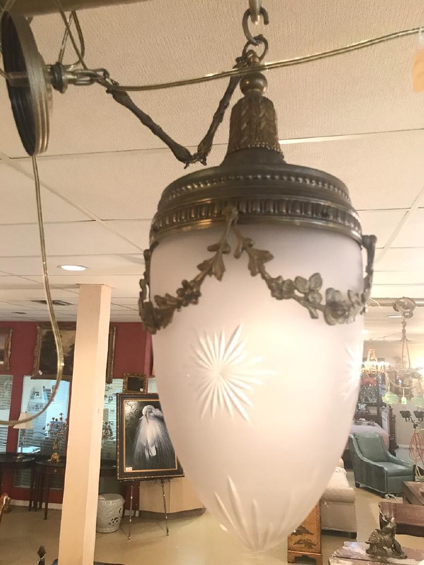 French Frosted Glass Lantern.: Tapered in form with decorative garland swags and starburst accents, circa 1930. 30H x 10 Dia. From the Sandra Clements Collection. EG3730