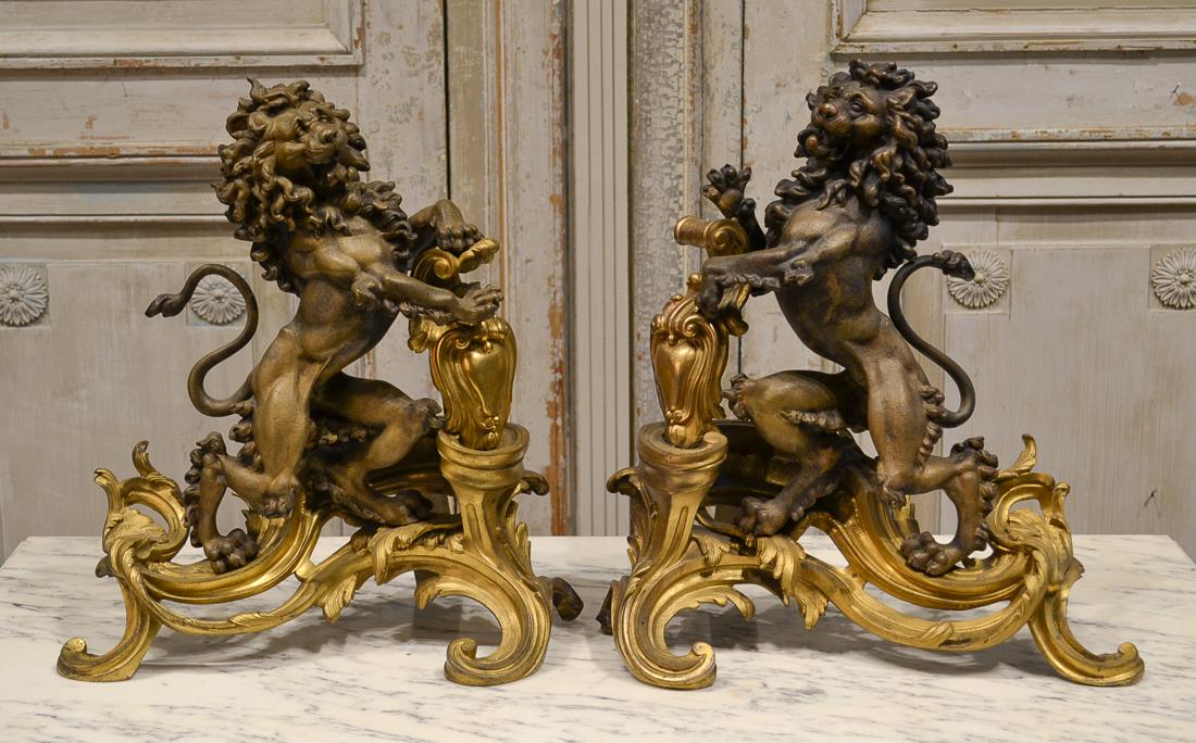Antique Pair Of French Bronze Chenet.: Fabulous Pair Of 19th Century French Gilt Bronze Chenet Fashioned With Roaring Lions And Shields. Raised On Rococo Inspired Bases. Good Condition. 16 X 16 X 8.75 Deep