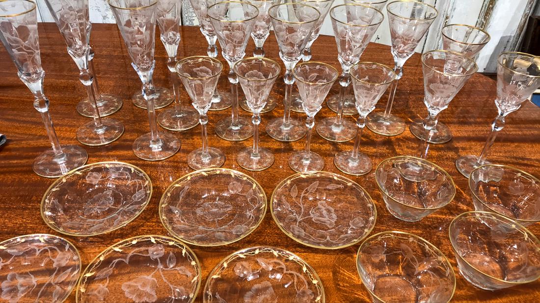 Crystal Moser Intaglio Stemware & Plates: Comprising 11 Champagne, 12 Red Wines, 9 White Wines,12 Sherries,12 Dessert Bowls, And 12 Dessert Plates. Excellent Condition. One Glass Has Small Chip.