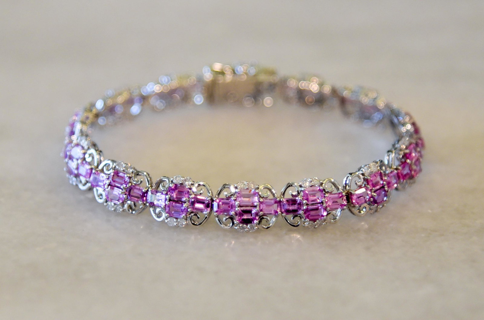 Pink Sapphire And Diamond Bracelet: 12.40 Ctw. Sapphire And 1.53 Ctw. Diamonds. See Photos For Certified Appraisal. Retail Value $19,100.00