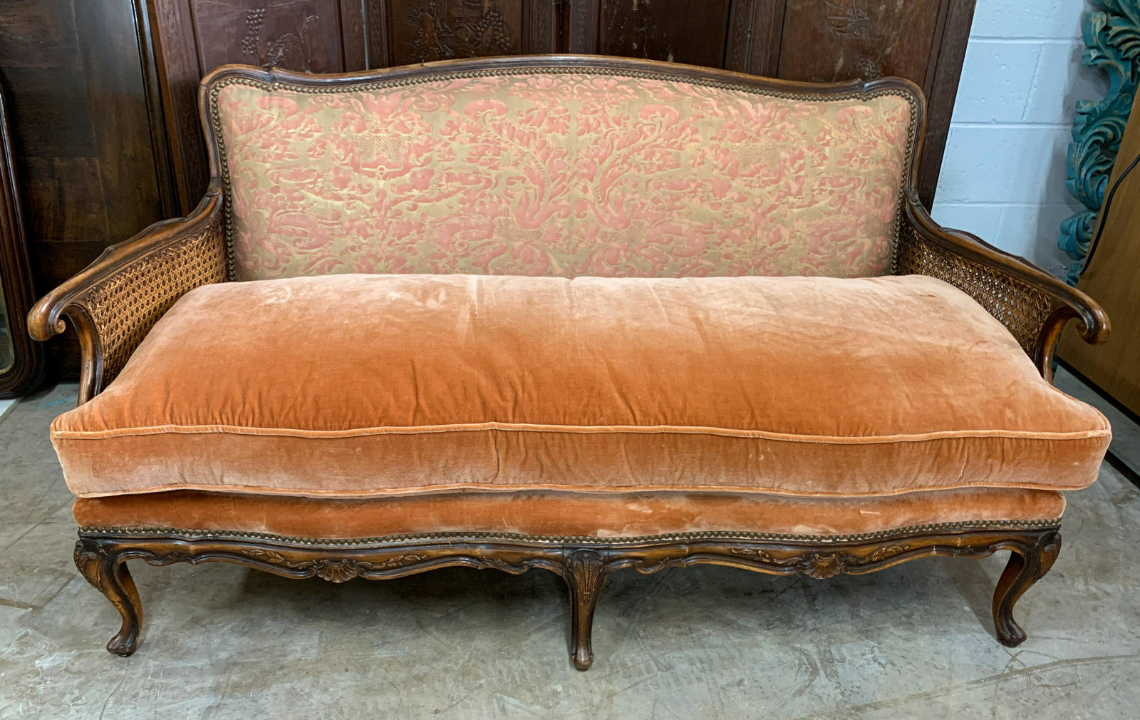 French Fortuny Covered Settee: Walnut with cut velvet seat; c. 1930. 48 w x 25 d x 33 h, seat height 17 w/cushion. Very good condition