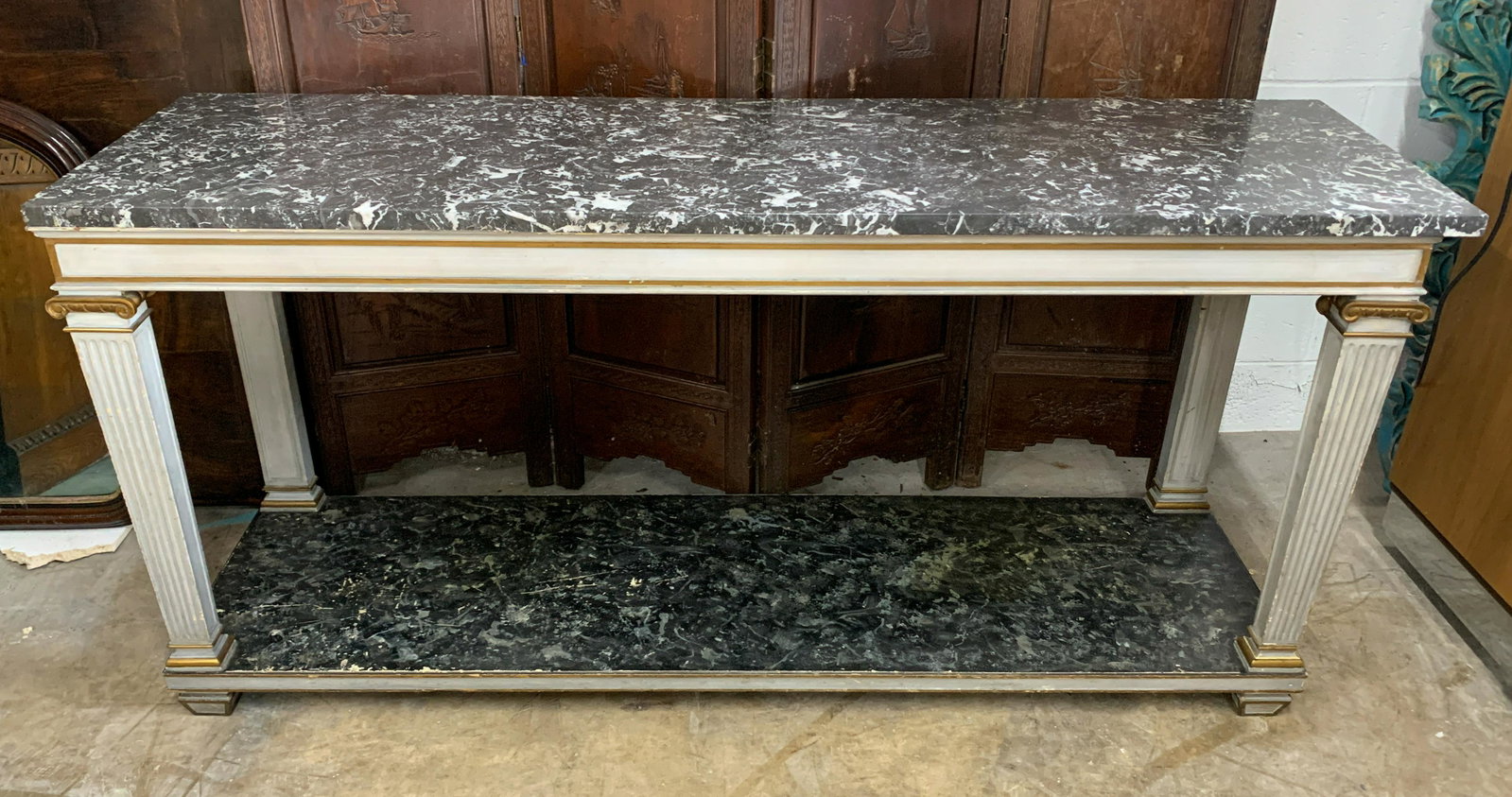 A French Painted Marble Topped Credenza: Great quality c. 1940 with good black marble top and faux marble lower shelf 71 inches long 18 inches deep 34 inches high