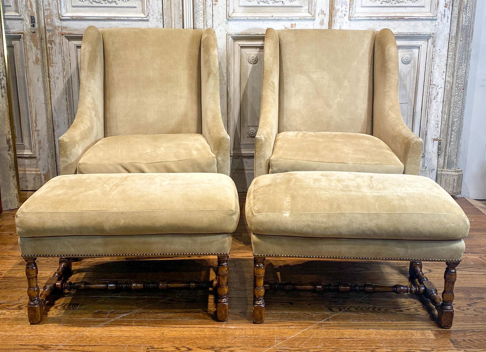 2 Dennis & Leen Wingback Chairs And Stools: Pair Of Dennis & Leen Taupe Suede Wingback Chairs With Ottomans 32x36x45h Upholstery Worn; See Photos