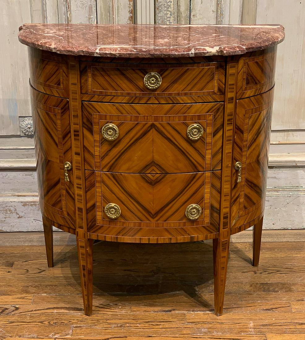 Fine French Demilune Inlaid Commode: Louis XVI Style With Marble Top. 32w X 15.5d X 34h. See photos for chip to bottom center of marble (well camouflaged) and slight loss to veneer. One chip to cabinet door. All slide and open smoothly.