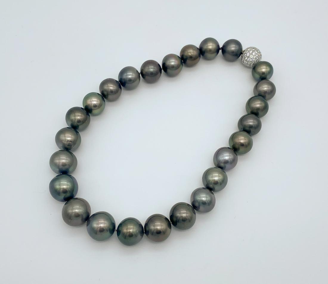 Nice Strand Of Tahitian Pearls: 15mm-17.5mm, 18k. Diamond Clasp, Unmarked. Recently Cleaned And Restrung. See Photos For Signs Of Wear Commensurate With Age. c. 1990 And Some Dings and Scratches Are Apparent. 8 inch drop.