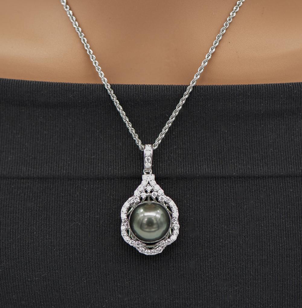 Platinum Tahitian Pearl And Diamond Pendant: Tahitian Pearl 14mm. Total Diamond Weight 0.99 Cts. See Photos For Certified Appraisal. Estimated Retail - $12,247.00