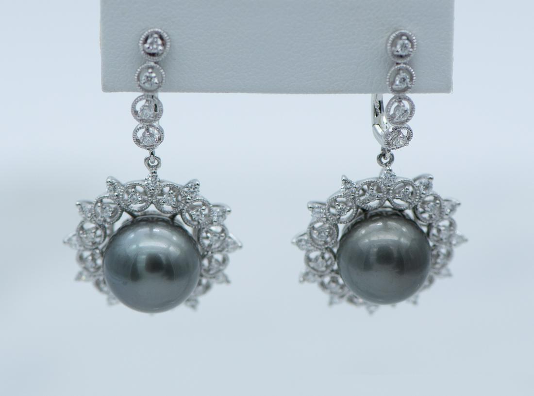 Platinum Tahitian Pearl & Diamond Earrings: 2 Tahitian Pearls 12mm. Total Diamond Weight 1.24 Cts. See Photos For Certified Appraisal. Estimated Retail - $13,410.00