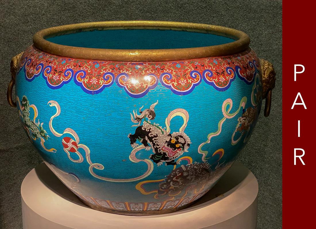 Pair Of Massive Cloisonne Cisterns: Planters / Jardiniere Decorated With Buddhist Lions Upon A Turquoise Ground. Cauldrons Each With Turquoise Interiors. Very Good Condition For Age. Opening is 29 inches with widest point measuring 40 i