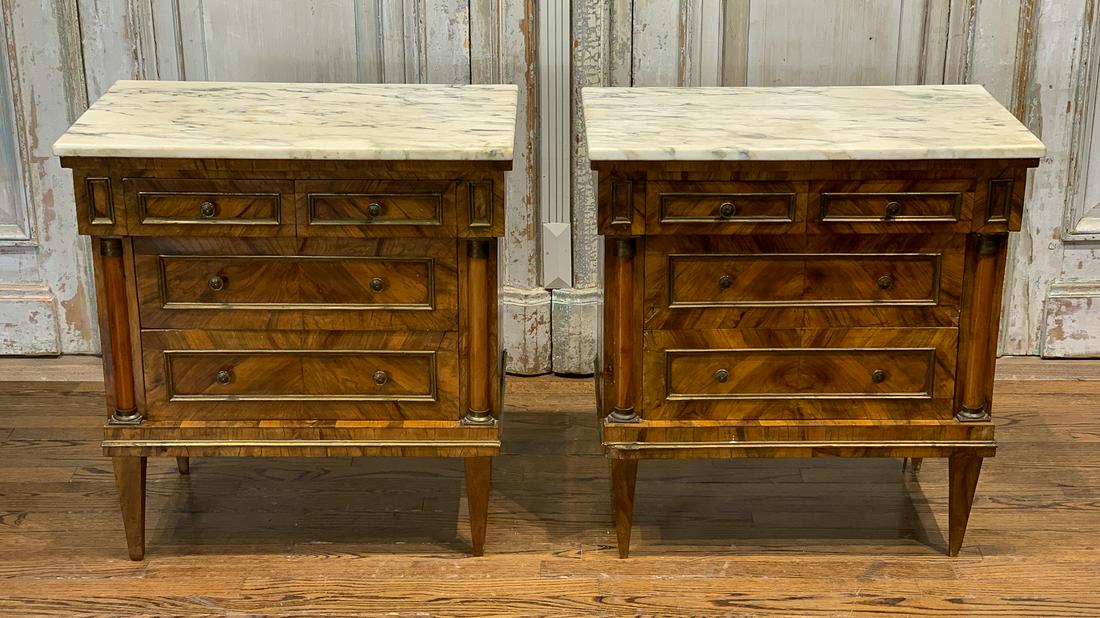 19th Century Pair Of French Empire Commodes: With Carrara Marble Tops. See Photos For Some Damage To Each, Some Loss To Inlay As Shown. See Corners And Legs. Marble Needs Polishing. Each 27w X 15.5d X 29h
