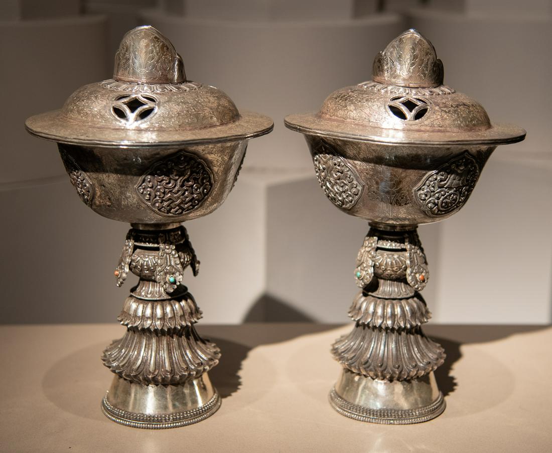 Pair Of Silvered Butter Lamps And Covers: With Lapis, Coral, And Turquoise. 5 Cabochons Are Missing And Hardstone Rings Are In Tact. Each On Custom Bases Designed By Atelier Gremillion. See Photos As One Lid Has A Spot Of Loss From Age. Talle