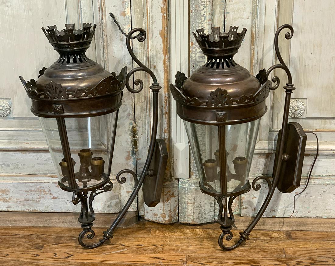 Pair Of French Style Lantern Sconces: Metal And Glass Carriage Style Lanterns With 3 Lights Each. Each 31h X 18.5d X 13w. Working Condition Unknown.
