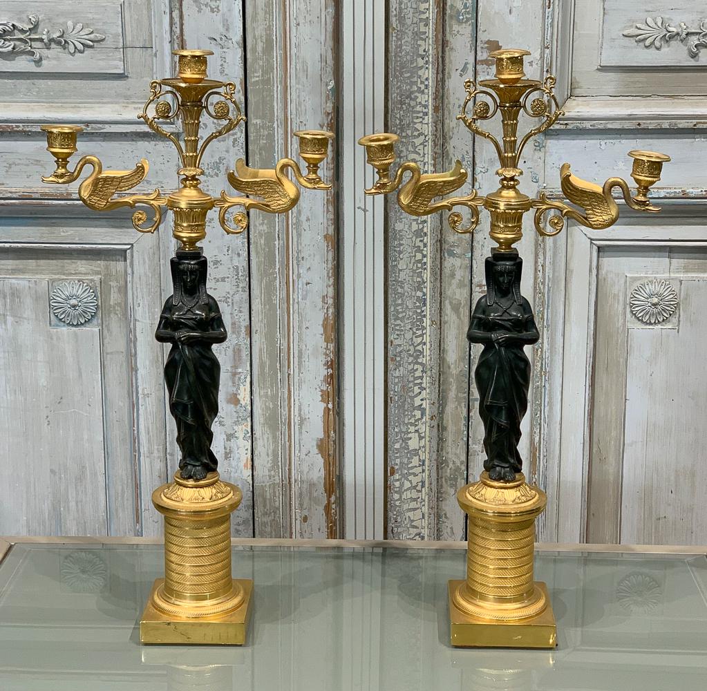 French Empire Style Gilt Bronze Candelabra: 20th Century With Gilt And Patinated Bronze. Each 24.5h X 12w X 4.5d. Good Condition.